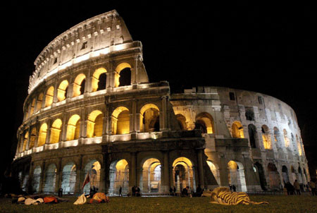 Polish pilgrims spend the night in front of Rome's ancient Colosseum after a procession to commemorate late Pope John Paul II in this April 8, 2005 file photo. The Great Wall of China, Petra in Jordan and Brazil's statue of Christ the Redeemer have been chosen to be among the modern-day seven Wonders of the World, the organizers of the competition said on July 7, 2007.