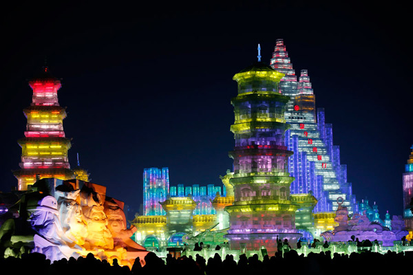 Ice sculptures shine at night in Harbin